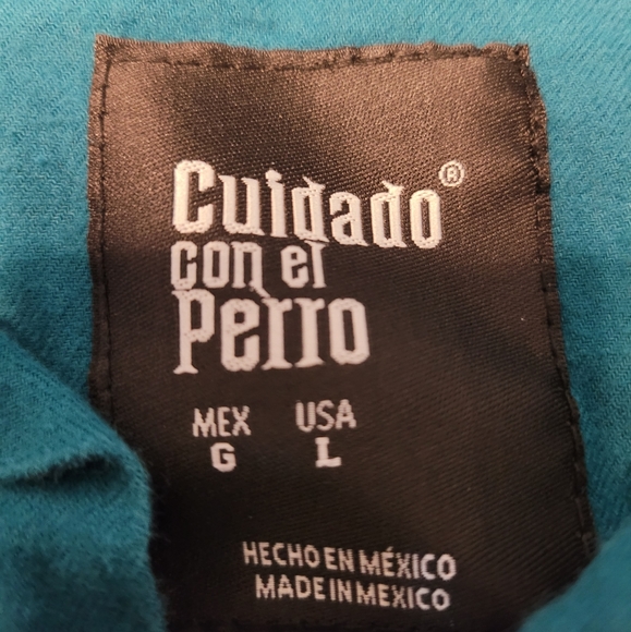 Cuidado con el Perro, Size Large, used good condition, teal in color. - Picture 2 of 3